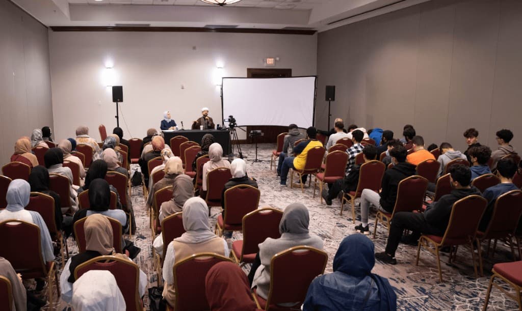 Conference session with scholars and attendees